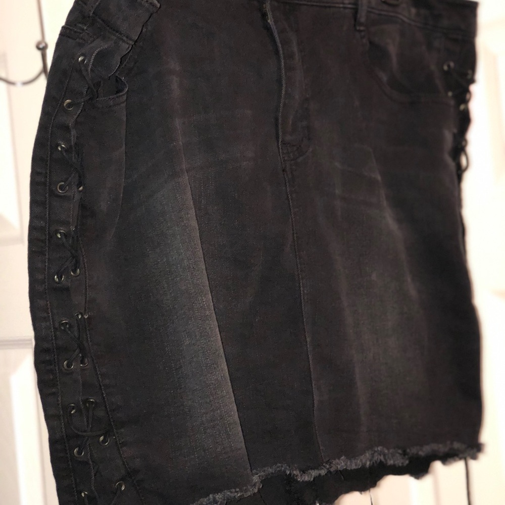 Black, ripped skirt with string detailing on side